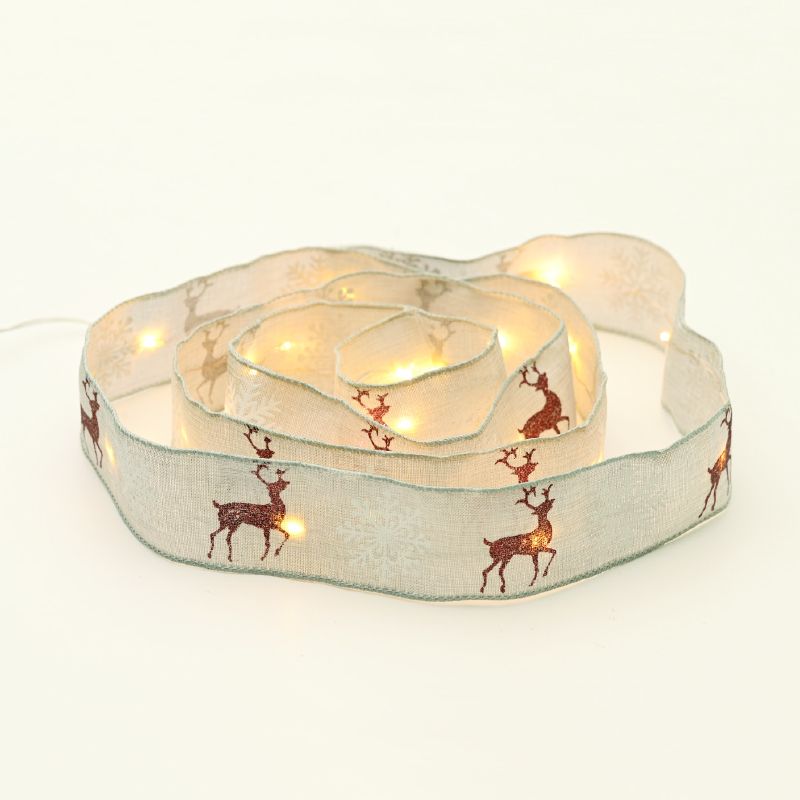 WHITE RIBBON WITH REINDEERS 20 LED ΛΑΜΠ.ΧΑΛΚΟΥ WW ΑΣΗΜΙ ΚΑΛ. ΜΠΑΤ:2XAA(ΔΕΝ ΠΕΡΙΛ) IP20 2m 30cm 1.2W ACA X07201189